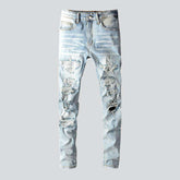 Mit Kristallen verzierte Patchwork-Jeans für Herren