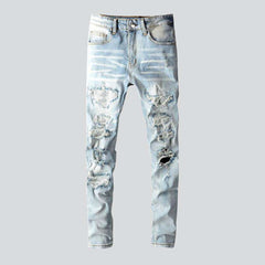 Mit Kristallen verzierte Patchwork-Jeans für Herren