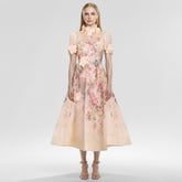 Beiges Midikleid aus Netzstoff mit Blumenapplikation