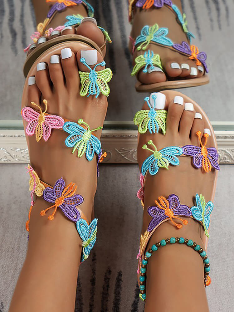 Strandsandalen mit Zehenring und Schmetterlingsmuster
