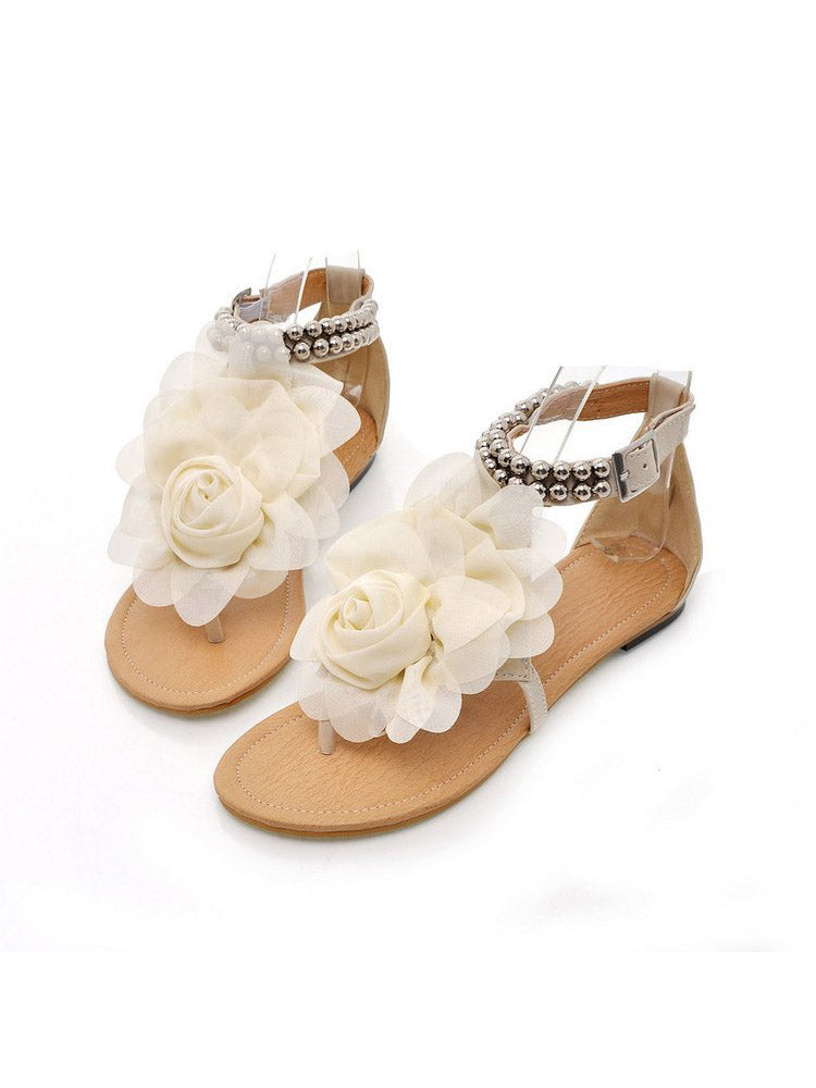 Flache Sandalen mit Blumen-String-Perlen und Knöchelriemen