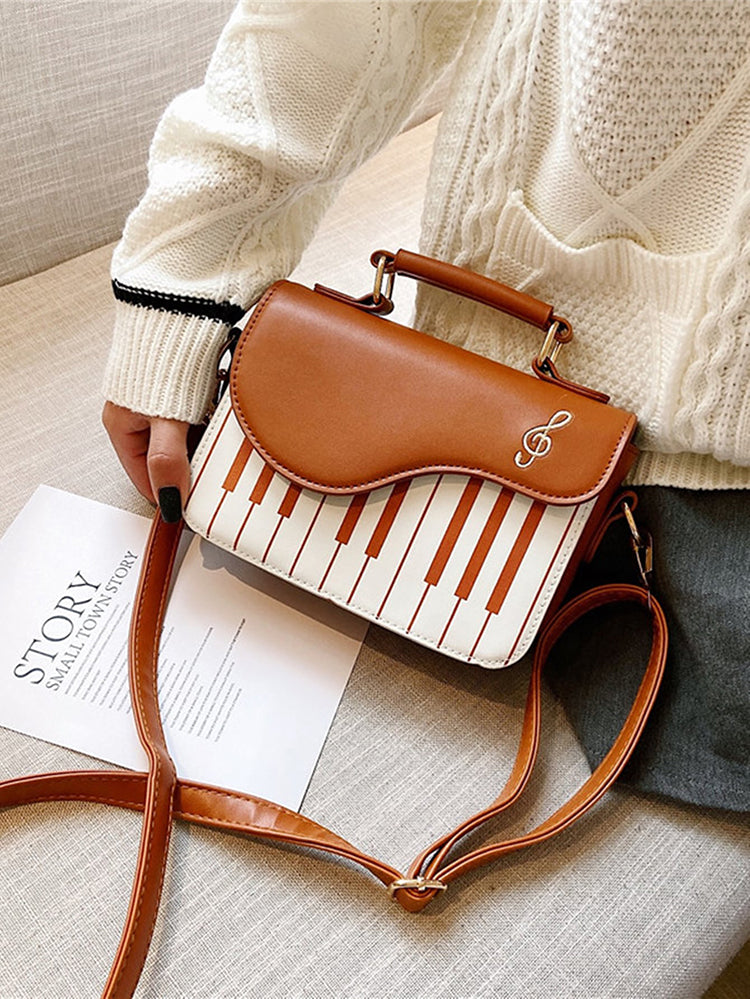 Bolsa bordada con estampado de música de piano