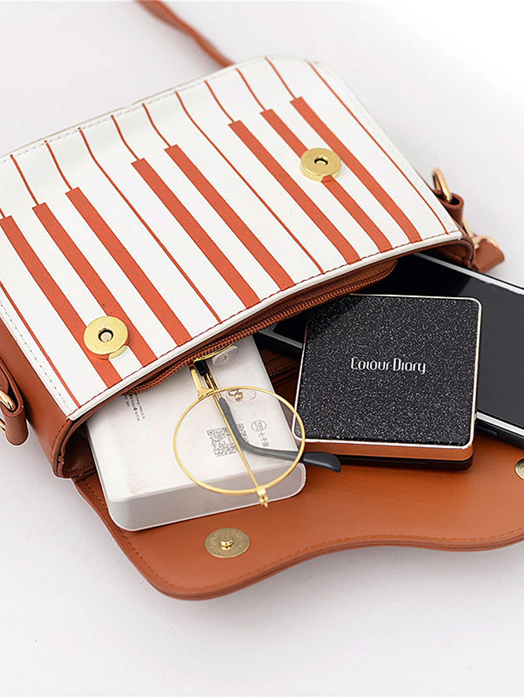 Bolsa bordada con estampado de música de piano