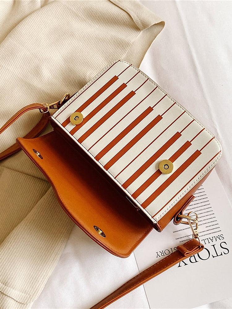 Bolsa bordada con estampado de música de piano