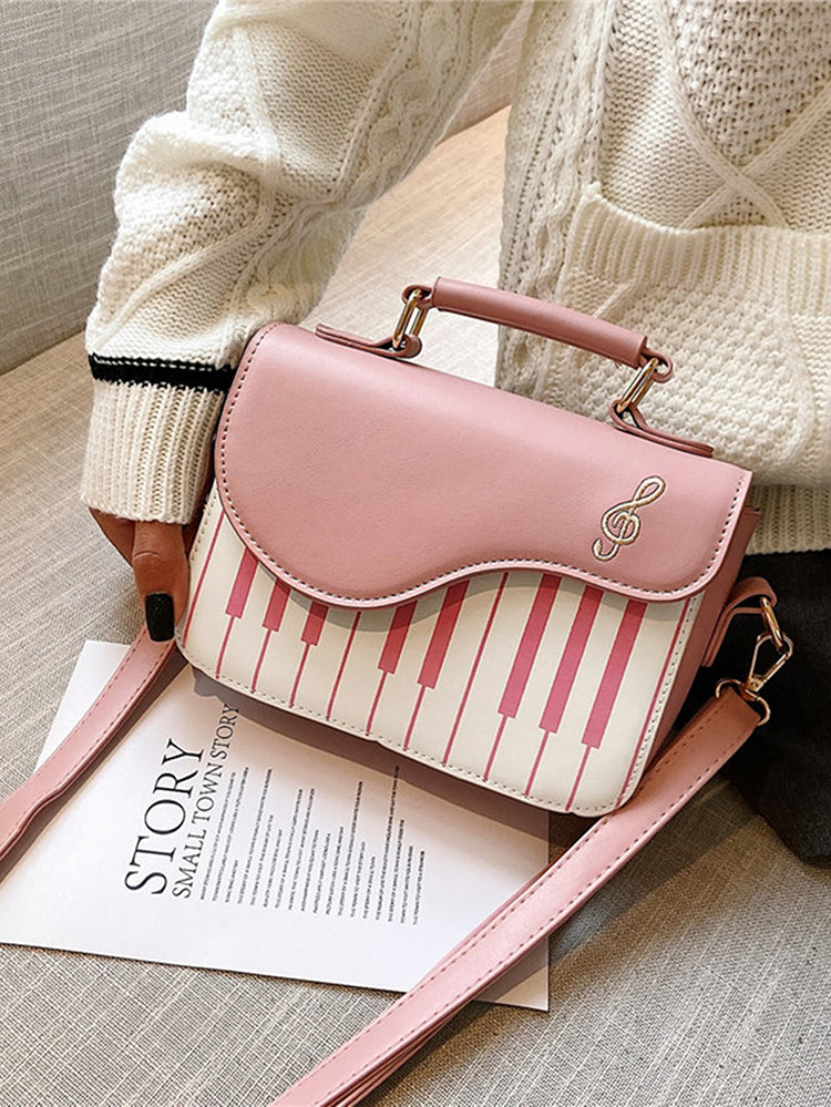 Bolsa bordada con estampado de música de piano
