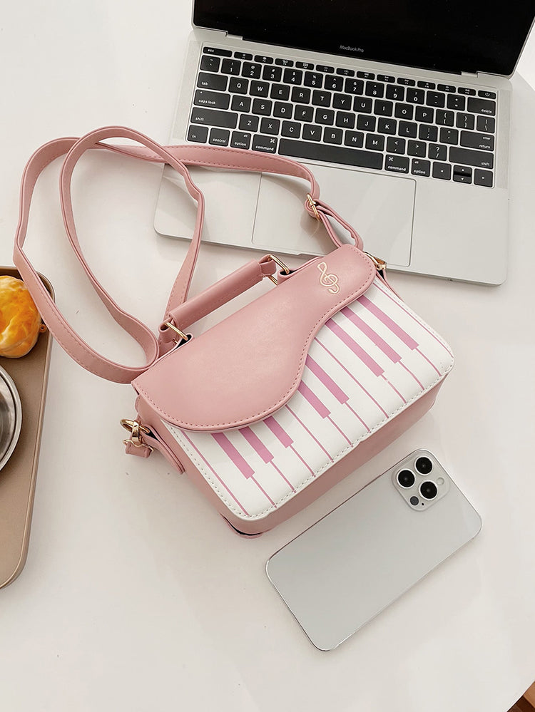 Bolsa bordada con estampado de música de piano