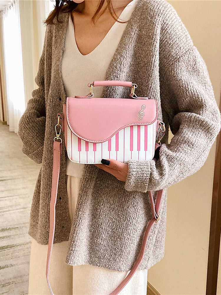 Bolsa bordada con estampado de música de piano