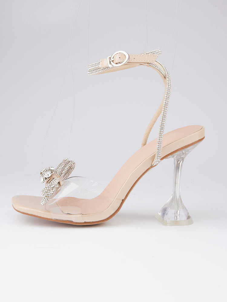 Tacones altos con punta cuadrada y lazo brillante