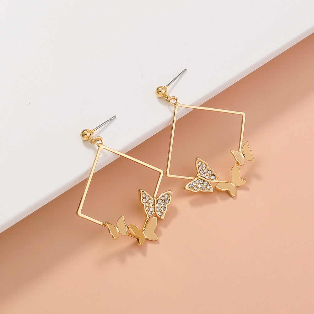 Pendientes de mariposa con tachuelas de diamantes de moda geométrica