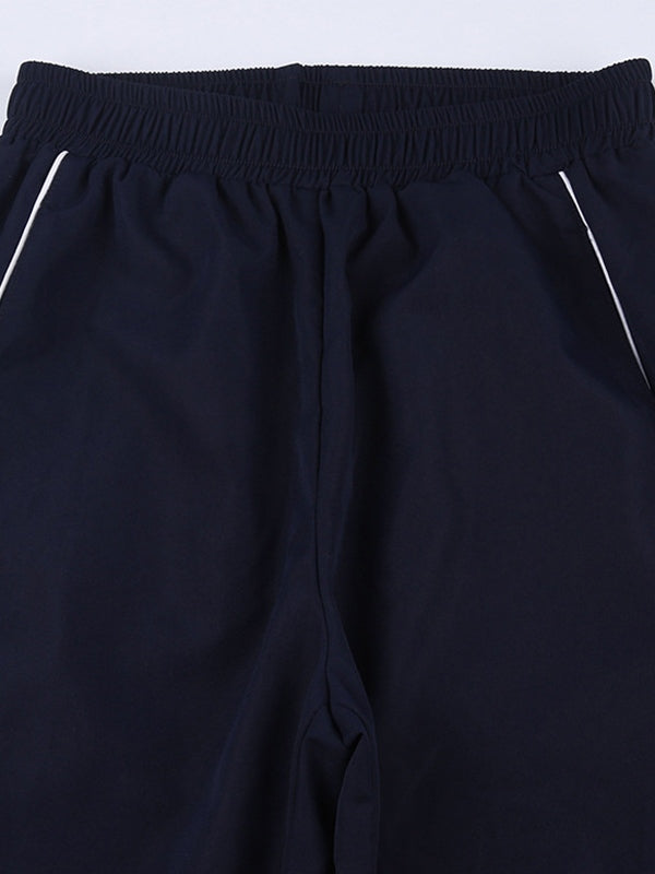 Pantalones deportivos holgados con ribete de rayas vintage