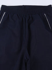 Pantalones deportivos holgados con ribete de rayas vintage