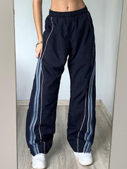 Pantalones deportivos holgados con ribete de rayas vintage