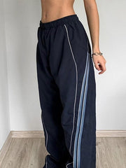 Pantalones deportivos holgados con ribete de rayas vintage