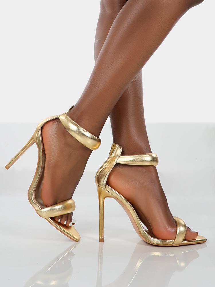 Goldene Sandalen mit Knöchelriemen