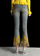 Schlaghose aus italienischem Denim in Blau mit hoher Taille, bestickten Taschen und Patchwork-Tüll