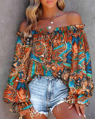 Blusa con hombros descubiertos y estampado brillante de Taj 