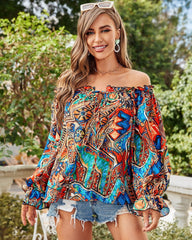 Blusa con hombros descubiertos y estampado brillante de Taj 