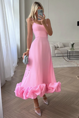 Vestido midi con bustier y volantes