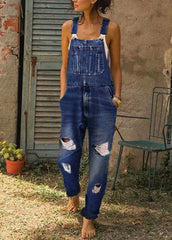 Style – Blauer, übergroßer Denim-Jumpsuit mit zerrissenen Taschen