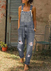 Style – Blauer, übergroßer Denim-Jumpsuit mit zerrissenen Taschen