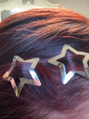 Pinza para el cabello con estrella hueca plateada