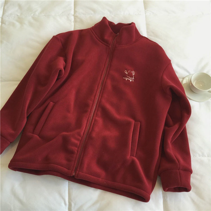 Chaqueta polar con cremallera y bordado