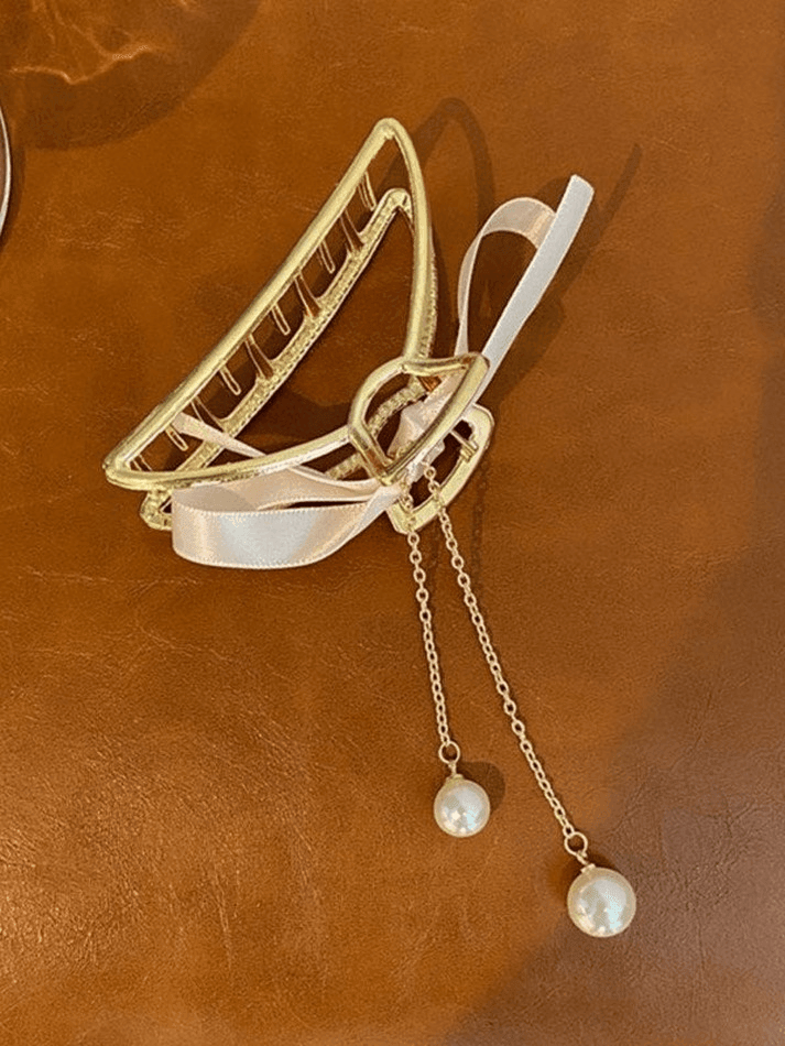 Pinza para el pelo con borla de metal y decoración de perlas