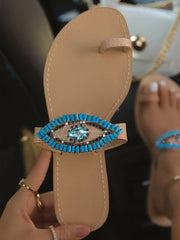 Slip-On-Sandalen mit bösem Blick
