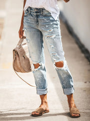 Pantalones vaqueros desgastados y rotos